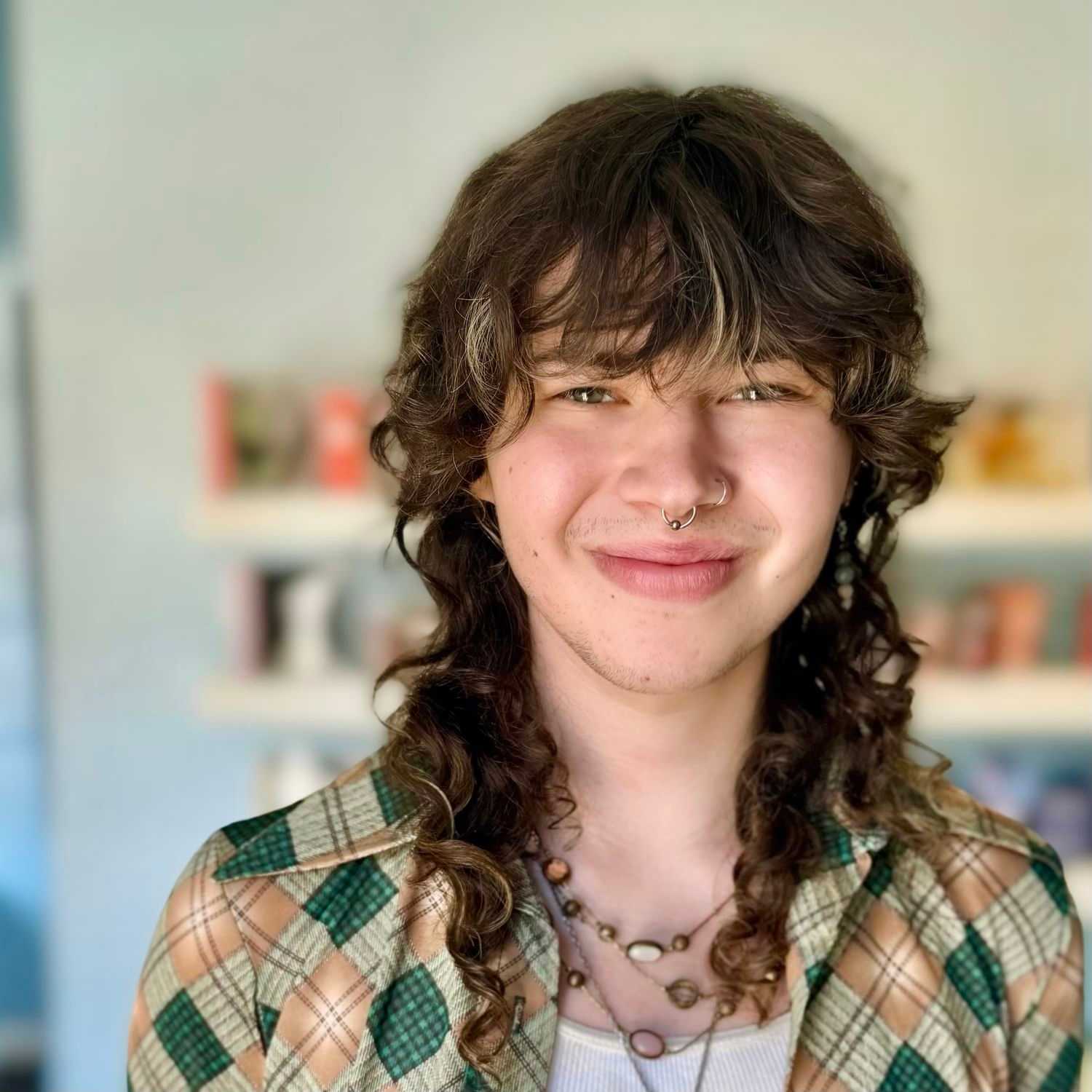 Portrait of Max, a professional stylist at Elixir x DV8 the salon, showcasing their expertise and style.