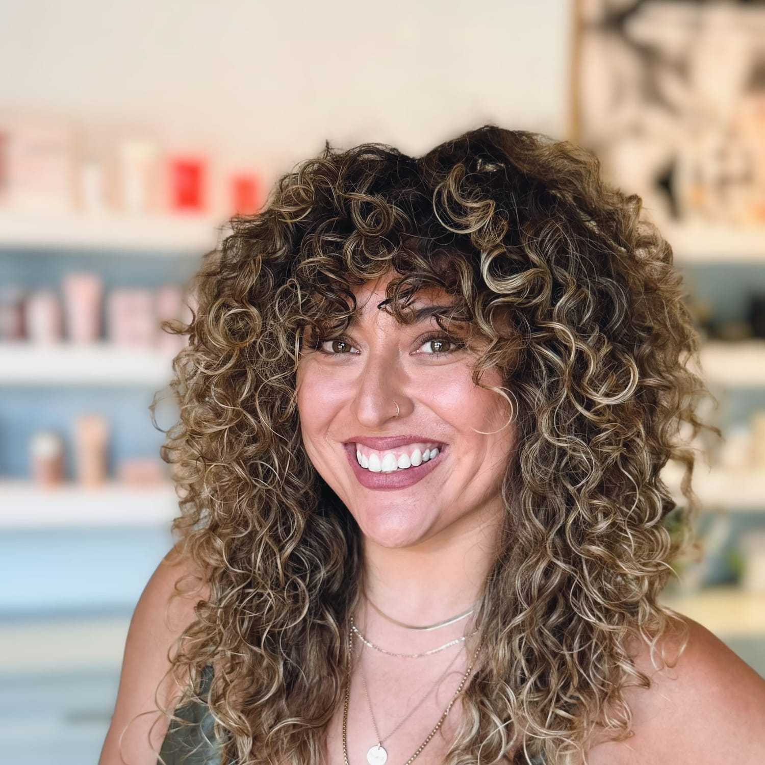 Portrait of Jasmine, a professional stylist at Elixir x DV8 the salon, showcasing their expertise and style.