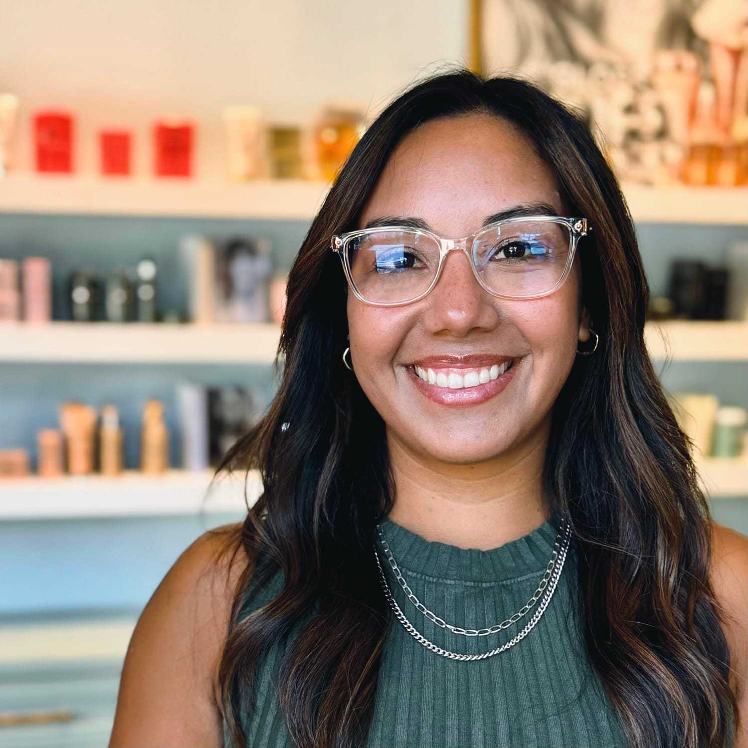 Portrait of Myra, a professional stylist at Elixir x DV8 the salon, showcasing their expertise and style.
