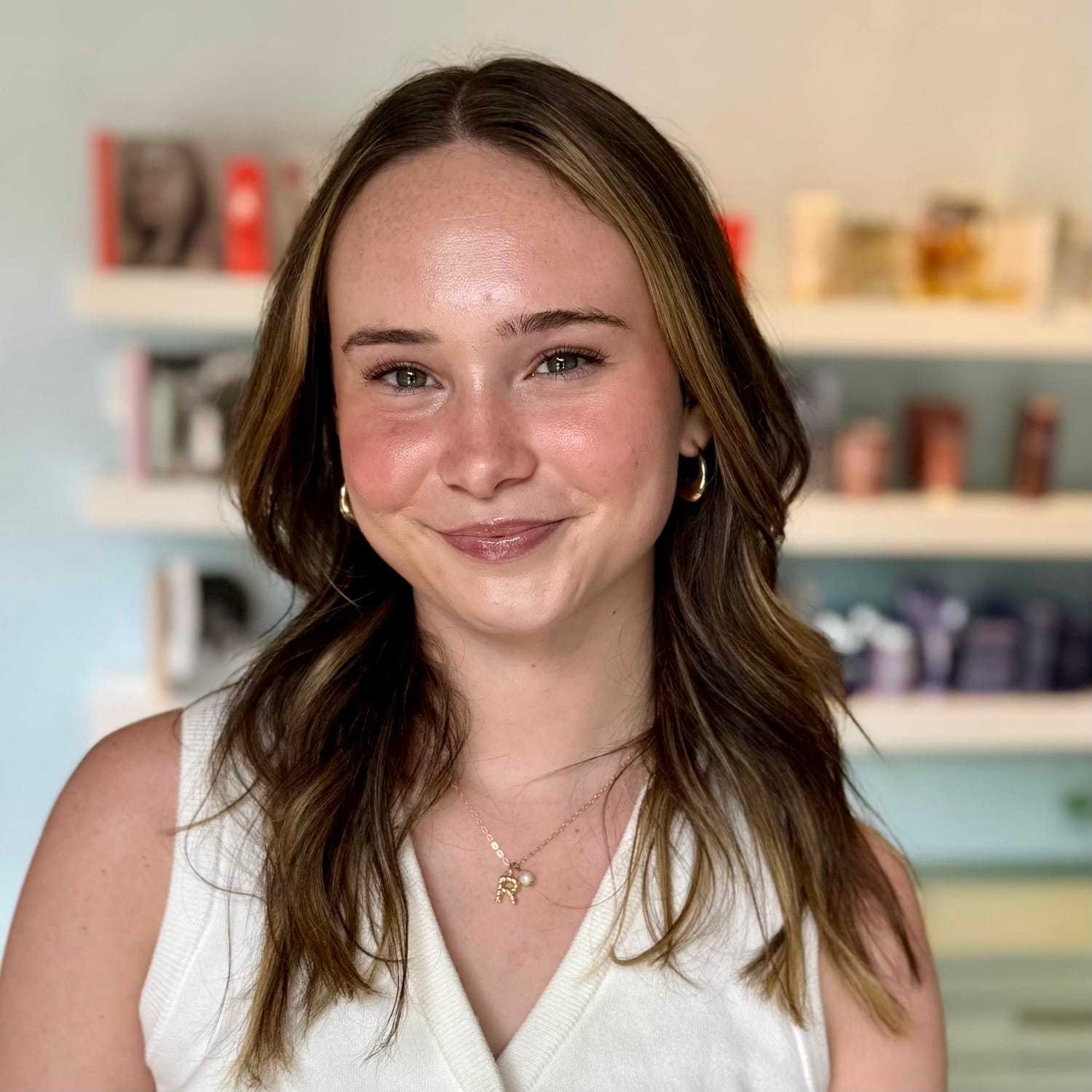 Portrait of Reagan, a professional stylist at Elixir x DV8 the salon, showcasing their expertise and style.