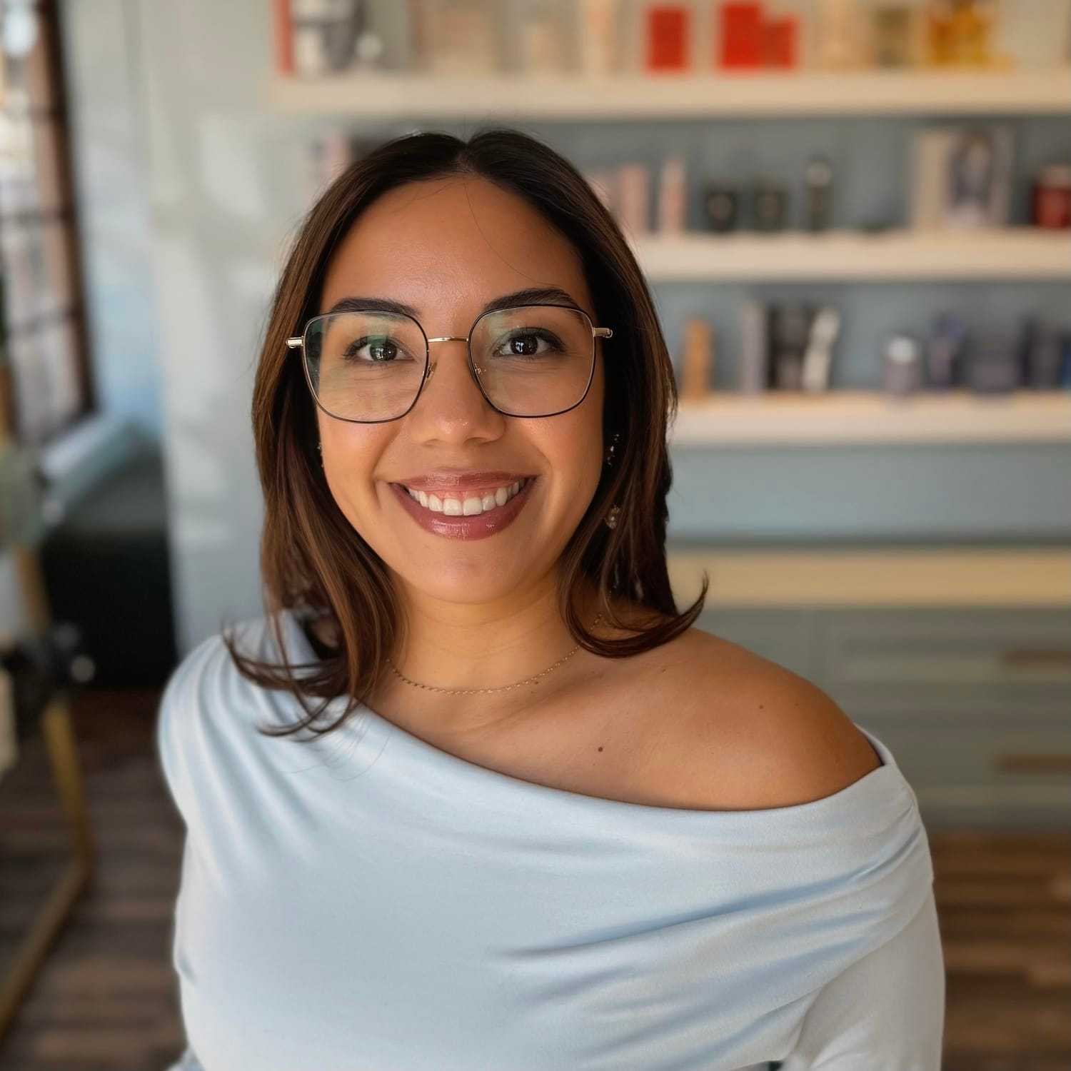 Portrait of Audri, a professional stylist at Elixir x DV8 the salon, showcasing their expertise and style.