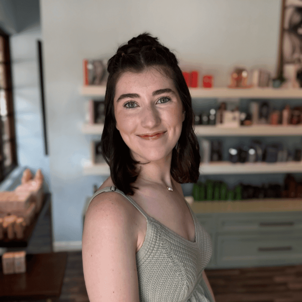 Portrait of Kate, a professional stylist at Elixir x DV8 the salon, showcasing their expertise and style.