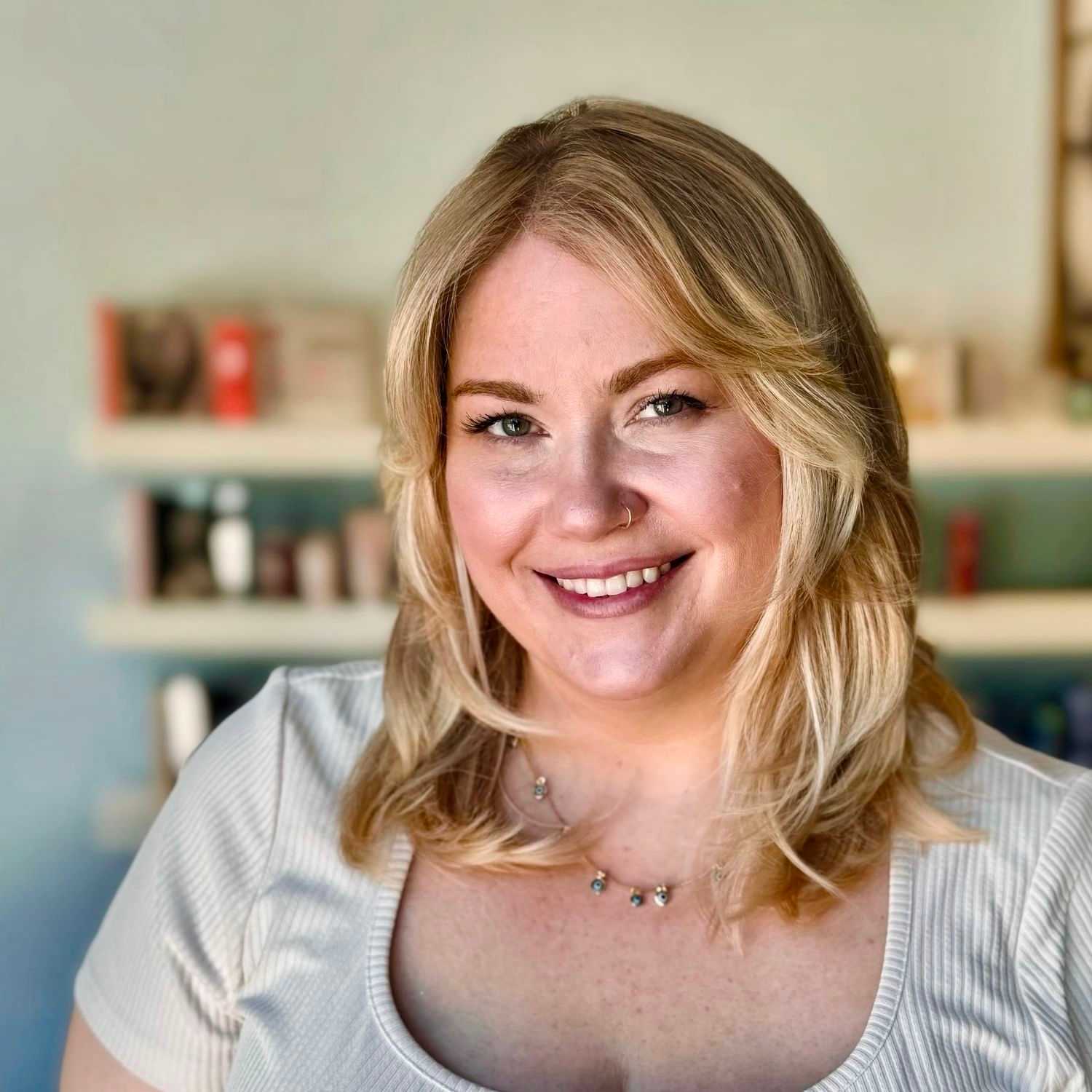 Portrait of Kelsey, a professional stylist at Elixir x DV8 the salon, showcasing their expertise and style.