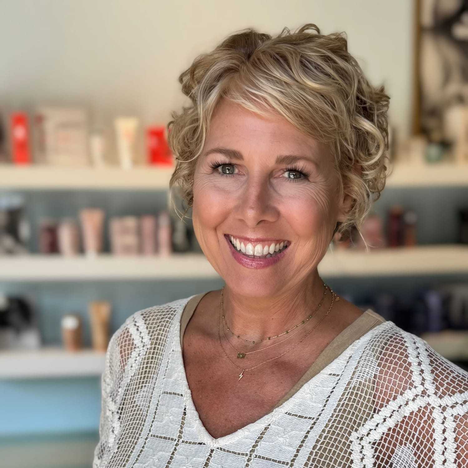 Portrait of Lisa, a professional stylist at Elixir x DV8 the salon, showcasing their expertise and style.